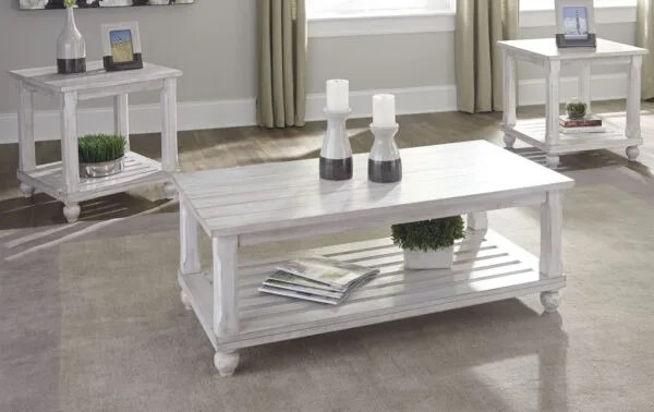 A set of multi-tiered rustic coffee tables made from natural wood with a white finish