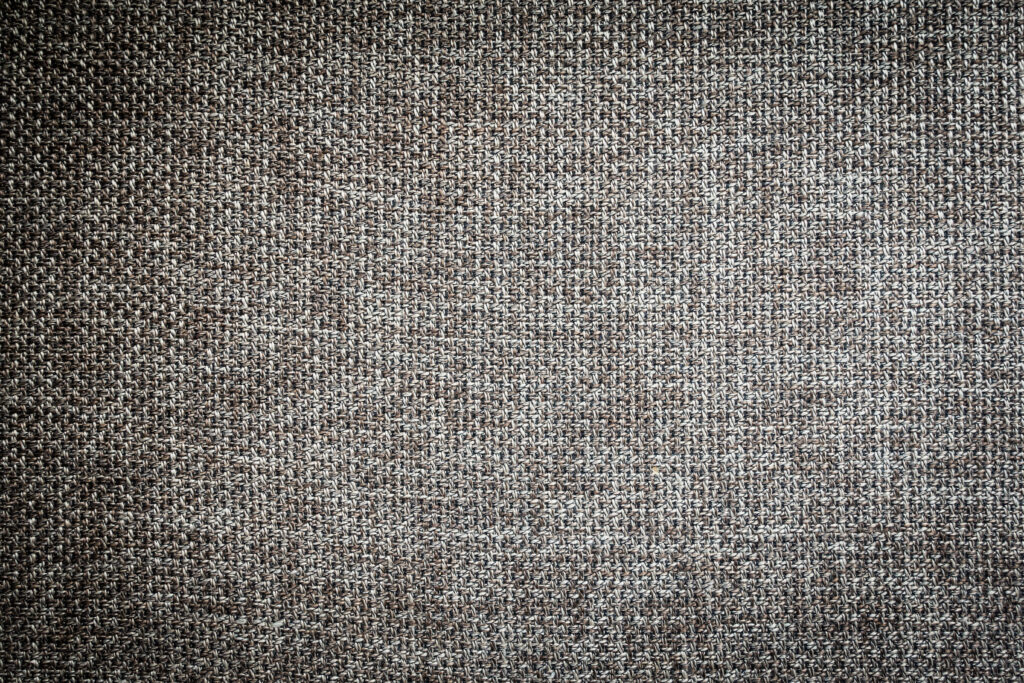 textured gray-black tweed upholstery fabric close up
