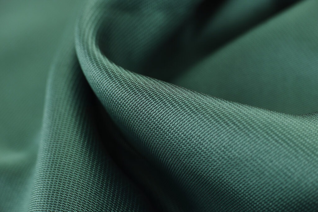 Close up of a green synthetic fabric blend