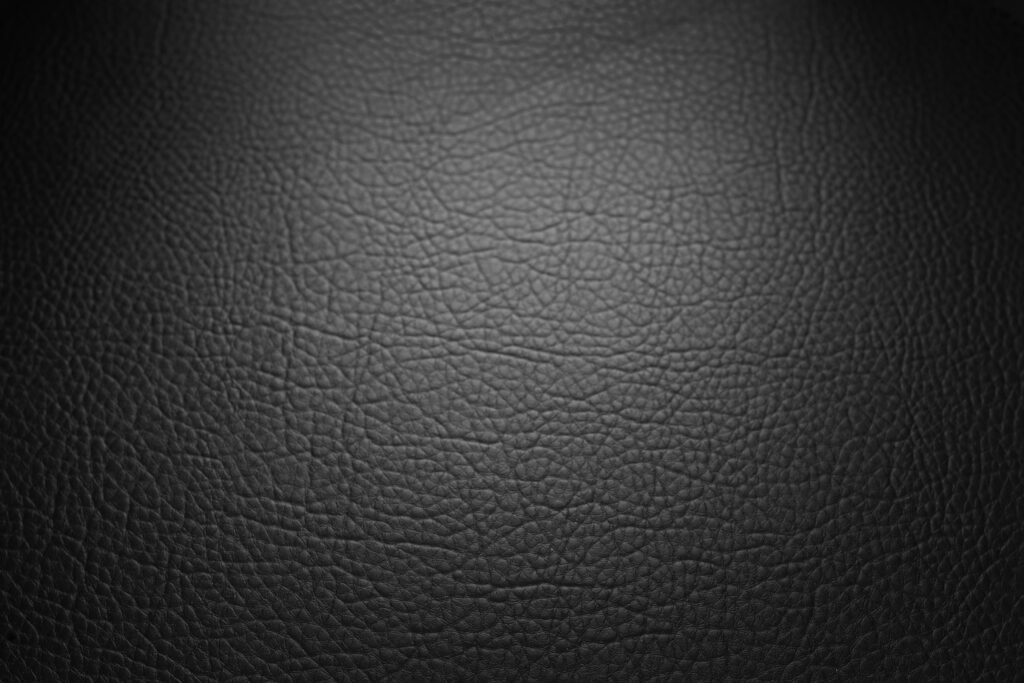 Close up of authentic leather in onyx black color