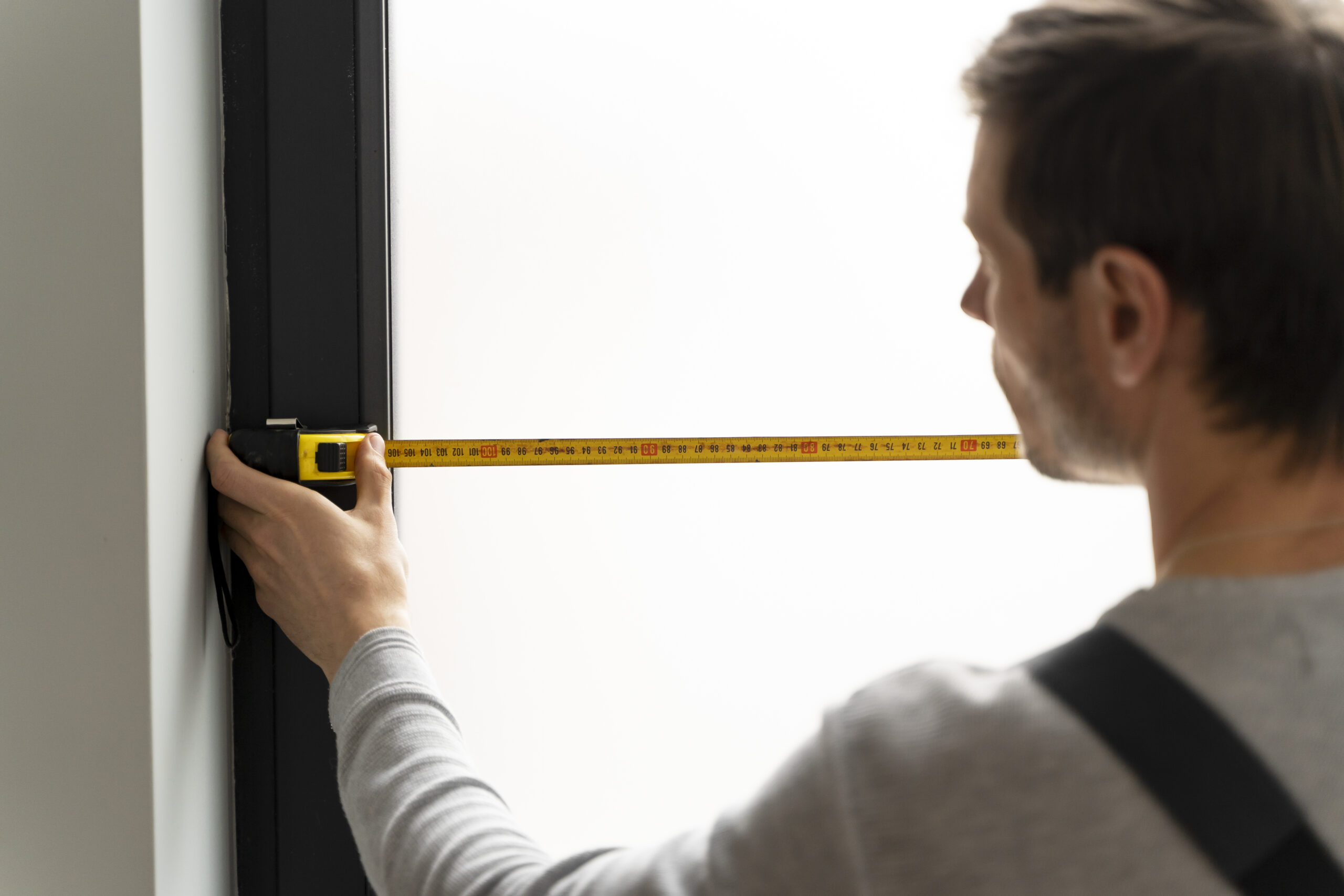 measuring space with a measure tap before buying furniture online