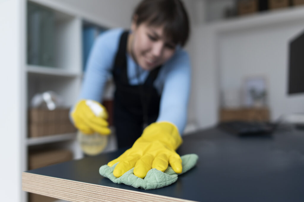 cleaning a wooden table for furniture refresh