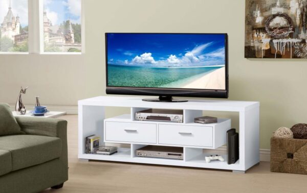 A minimalist, modern TV stand with cantilevered shelves and floating drawers in a small apartment