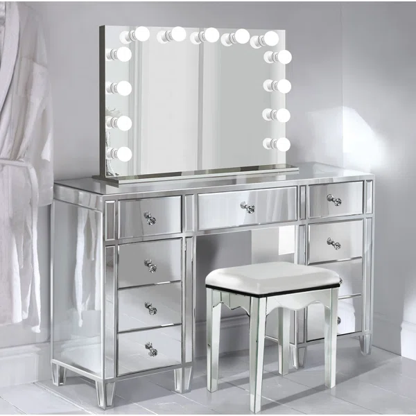 shiny and reflective hollywood vanity table with multiple storage drawers