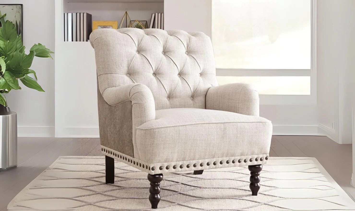 Traditional style accent chair with turned legs, rolled arms, and tufted back