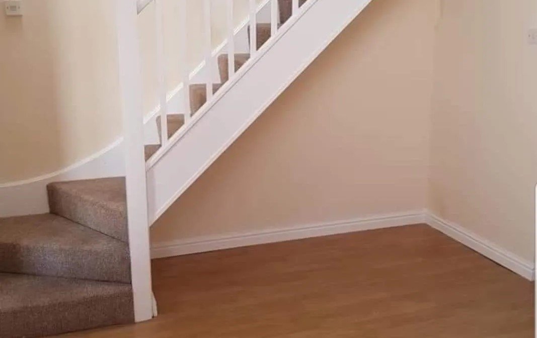 Empty space under the stairs for a cozy reading nook