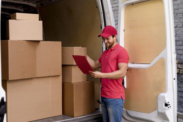 deliveryman unloading furniture delivery